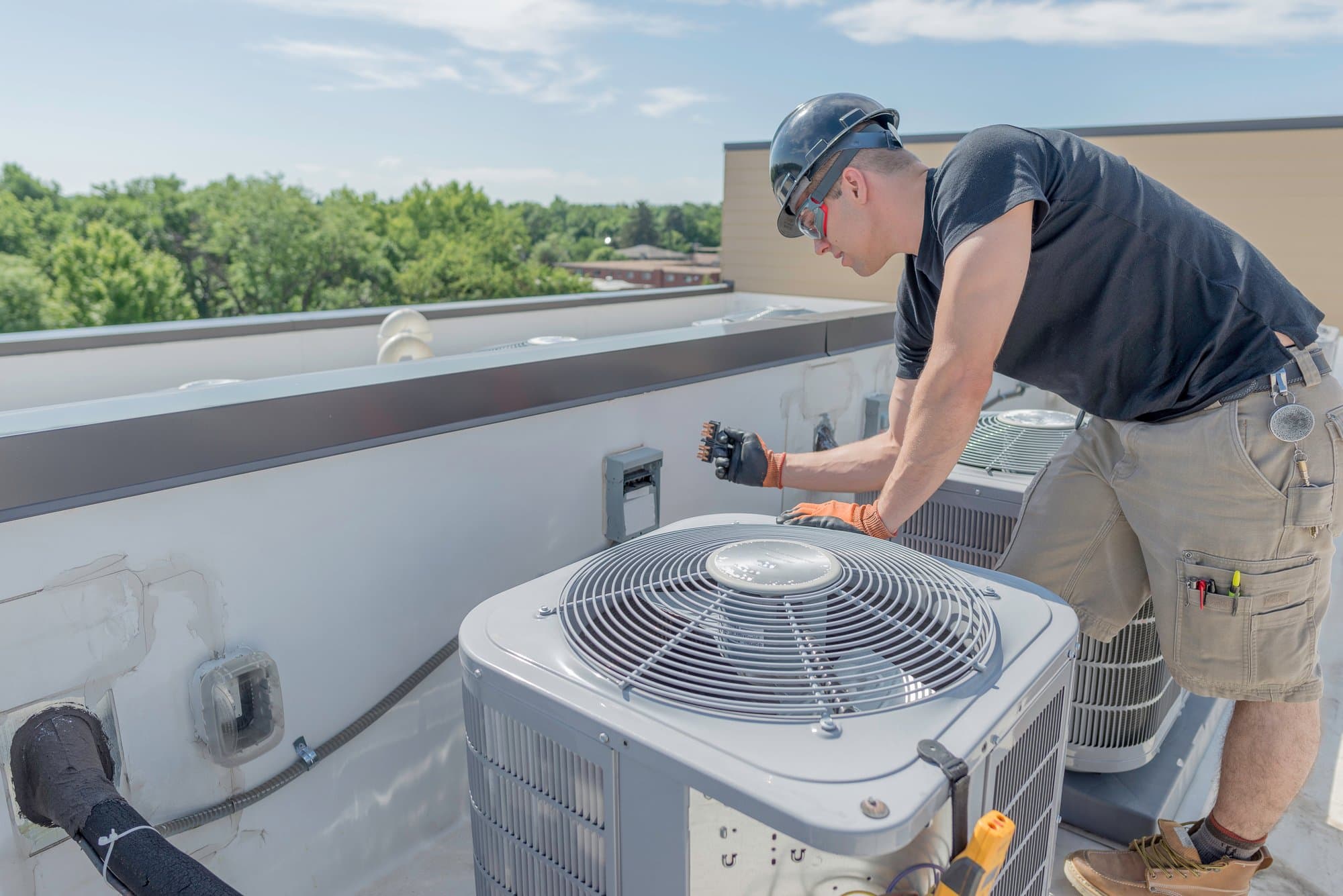 Clean mechanical room installation with labelled refrigerant lines and sealed ductwork