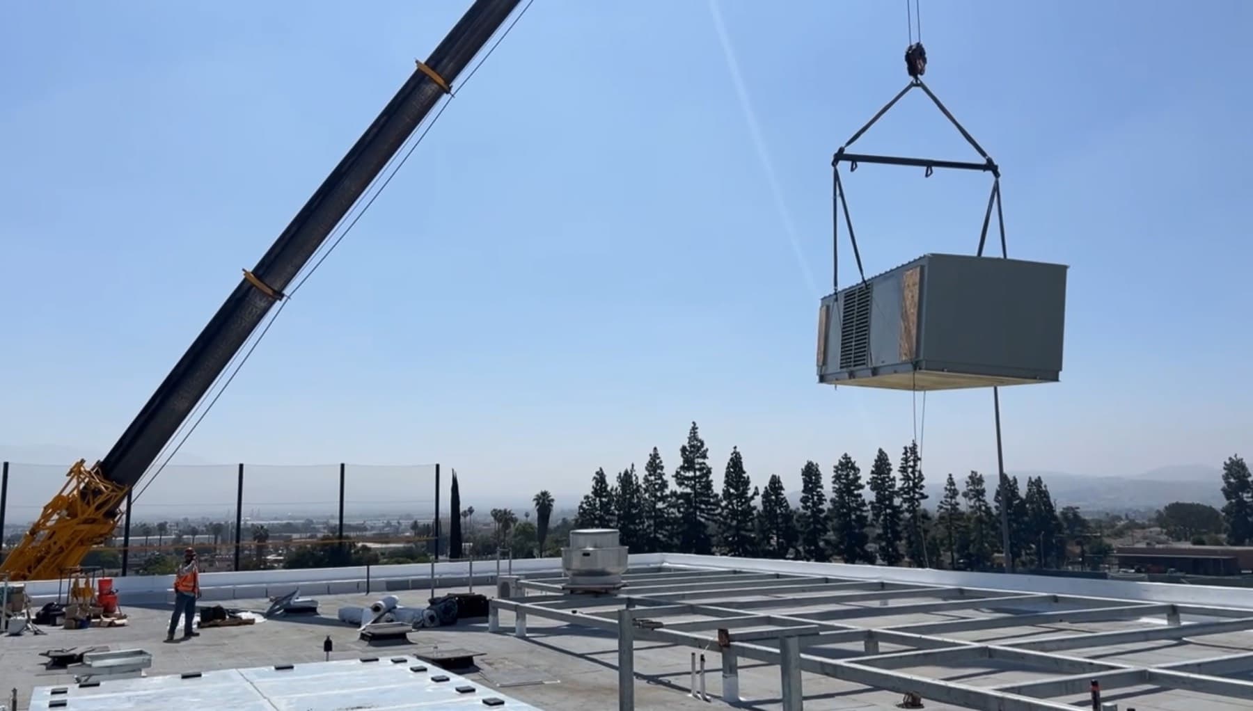 Industrial rooftop equipment set by crane