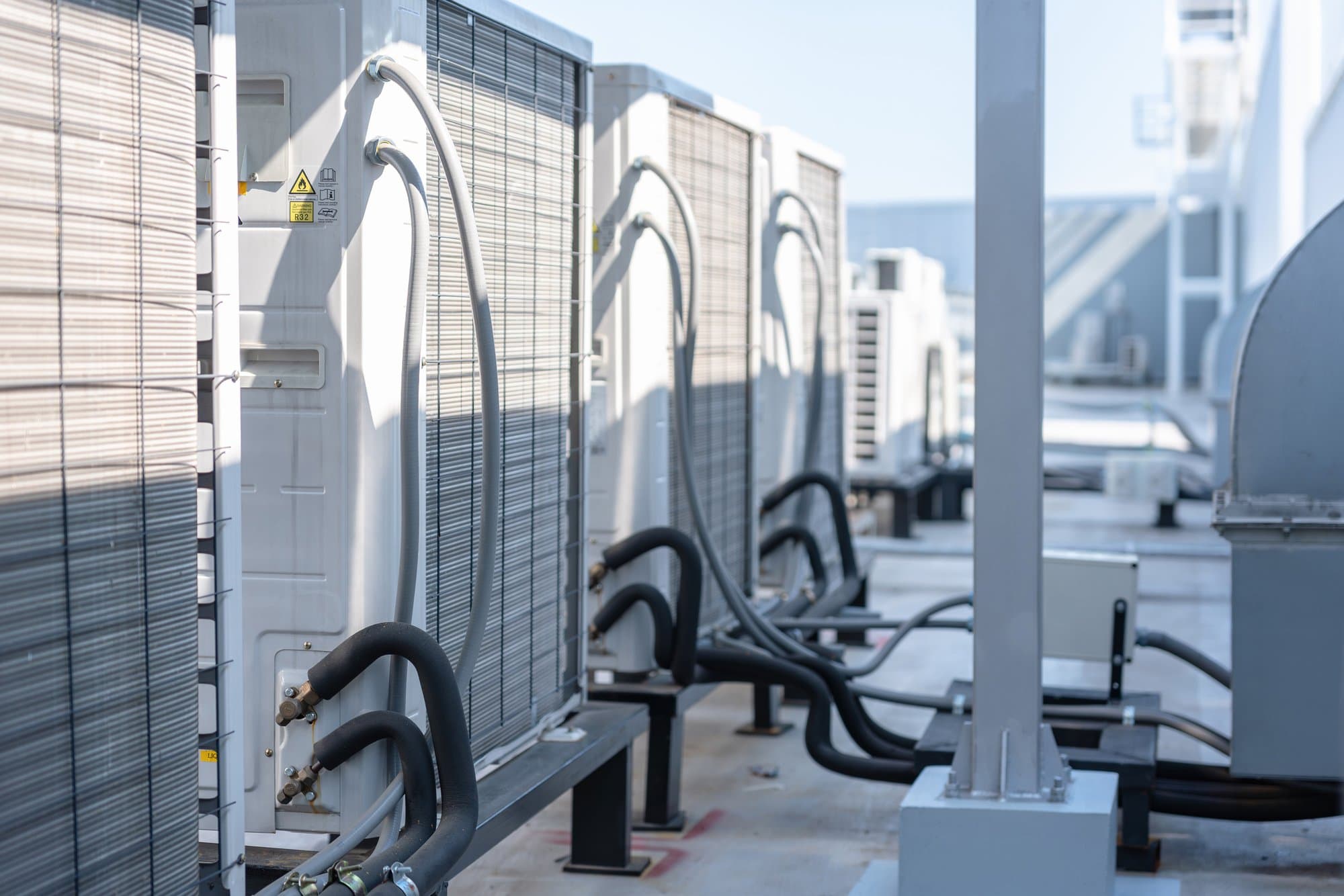 Condensing units with new sheet metal on a hot roof